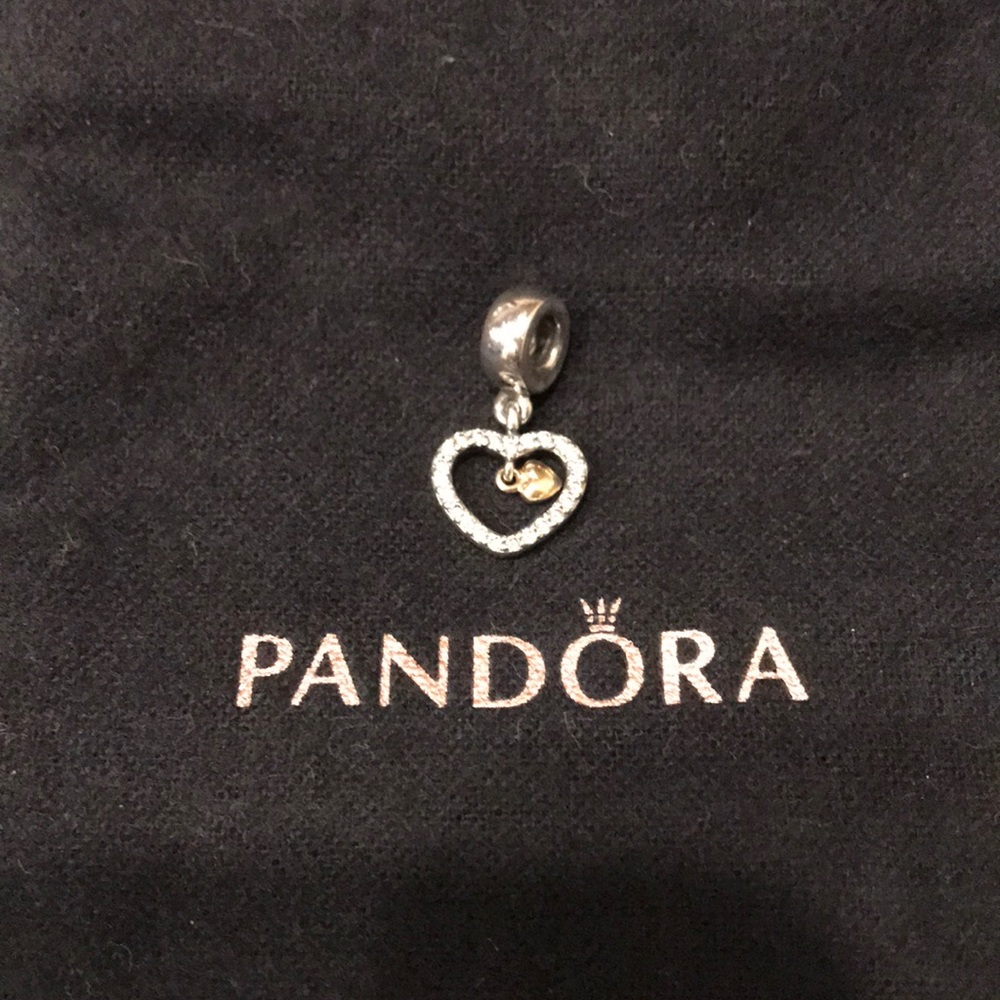 Pandora floating heart charm.
